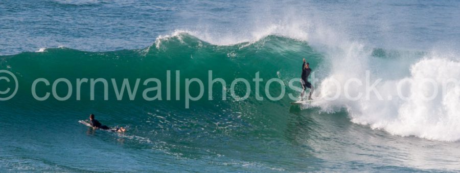 Surfer With Hand In The Air